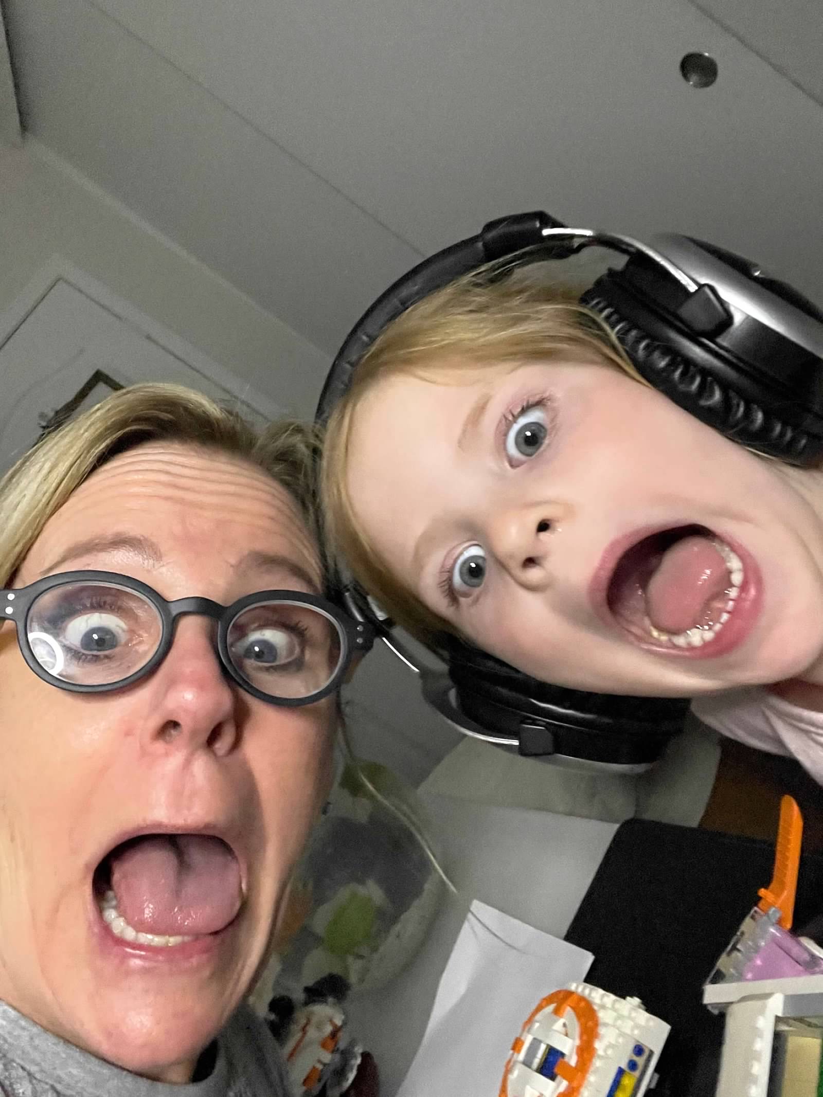 Susan and child making wild excited faces together