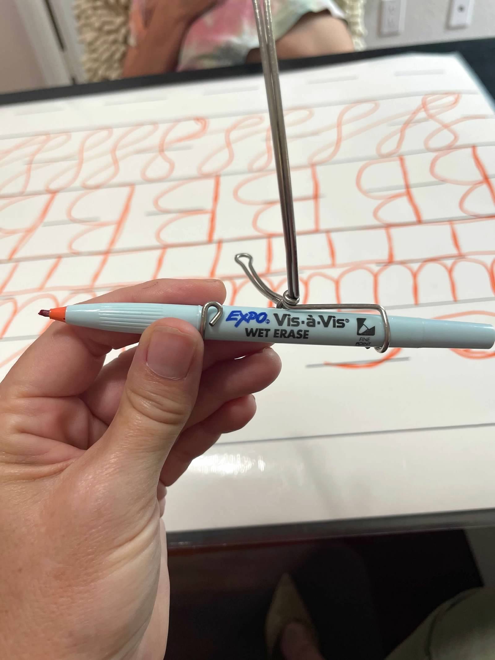 NILD wet-erase pen tool with rhythm worksheet